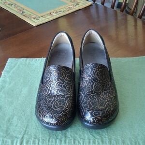 Alegria Floral Embossed Black and Gold Slip-On Shoes